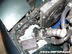 The new cold air intake (CAI) passes through the sheet metal of the 240sx and puts the filter just behind the bumper.