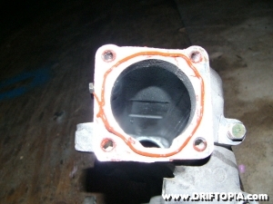 A thin layer of RTV is used as the new tb gasket.