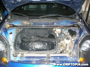 Jpg image showing the MR2 Spyder in daily driving trim with the TRD front strut bar installed.