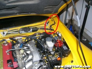 Notice how the gauge wires are run around the hood hinge on the Honda S2000