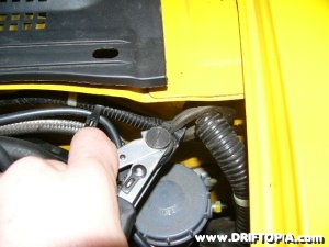 Jpg image showing the grommett that needs to be removed from the Honda S2000 to pass the wires of the boost gauge through the firewall.