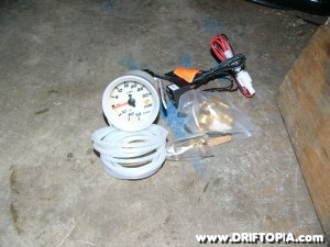 Jpg image showing the Faze electric boost gauge before installation on the Comptech Supercharged S2000.