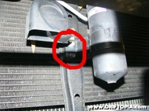 Remove the two bolts from the condenser bracket to remove the bracket from the s2000