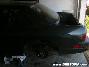 Side view of the removed tein coilovers from the rear suspension on the 240sx
