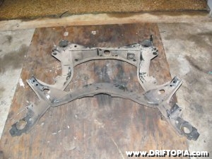 The rear suspension members removed from the rear subframe on the 240sx