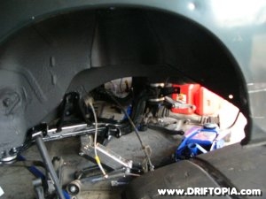 Image of the reinstalled subframe with the new solid bushings on the Nissan 240sx s13