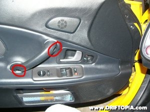 Remove the two screws from the door handle on the honda s2000