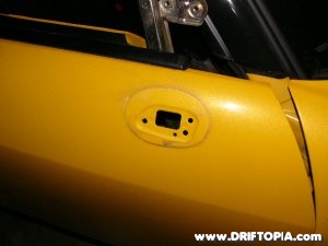 The S2000’s door with the side view mirror removed.