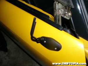 The APR side view mirror base attached to the passenger’s side of the Honda S2000