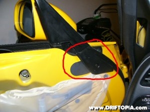 Remove the highlighted trim and cover to gain access to the upper window track bolts on the Honda S2000