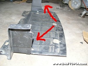 Jpg image of the front center skid plate cut to accommodate the fmic on the comptech supercharged honda s2000