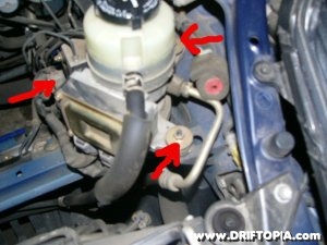 Disconnect the p/s pump from the frame of the mr2 spyder at these points