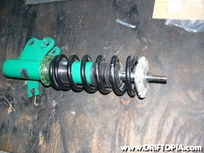 The Tein basic coilovers with the factory rubber mounts removed.