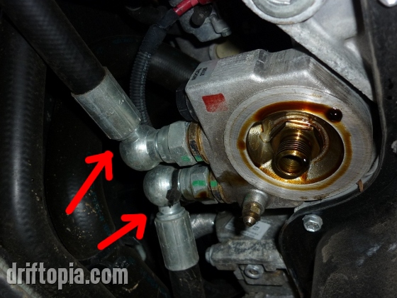 Make sure to inspect the oil cooler fittings and lines for leaks before installing the new oil filter.