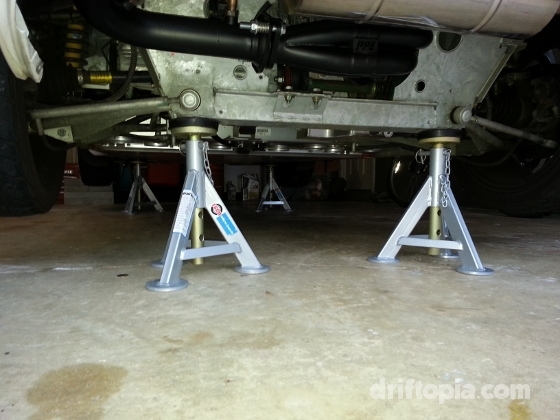 All four corners of the Lotus Elise lifted on jack stands.  Notice the positioning of points D on the subframe.