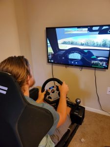 Simple but effective iRacing rig. Fanatic wheel and pedals.