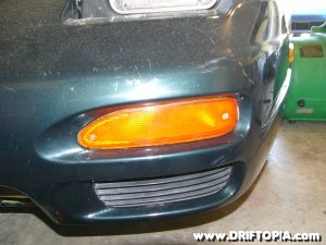 The front turn signals of a Nissan 240sx.