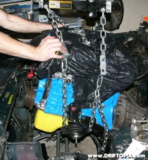 Image showing the ca18det motor being removed from the engine bay.