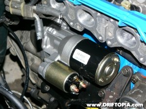 The new starter from a 1986 Nissan 200sx installed on the ca18det.