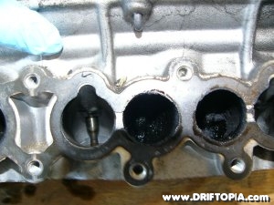 Image showing the gunk built up on the #2 cylinder's valve stems of the CA18DET motor.